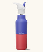 Klean Kanteen Dazzling Blue Rise Insulated Classic Bottle with Flip Seal Cap raised, showing reusable and removable metal straw.
