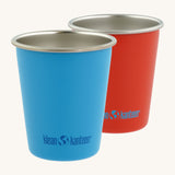 Pair of Klean Kanteen stainless steel 10oz kid cups in red and blue - durable, plastic-free tumblers made from post consumer steel, available to buy from Babipur.