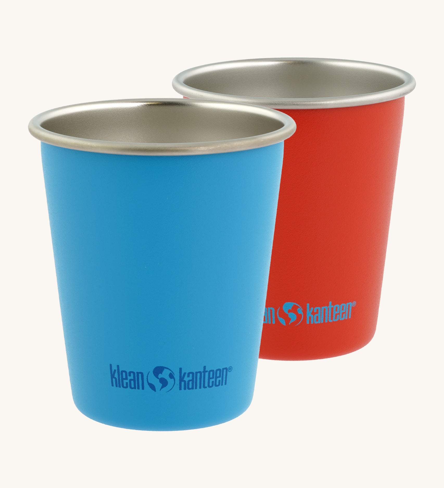 Pair of Klean Kanteen stainless steel 10oz kid cups in red and blue - durable, plastic-free tumblers made from post consumer steel, available to buy from Babipur.
