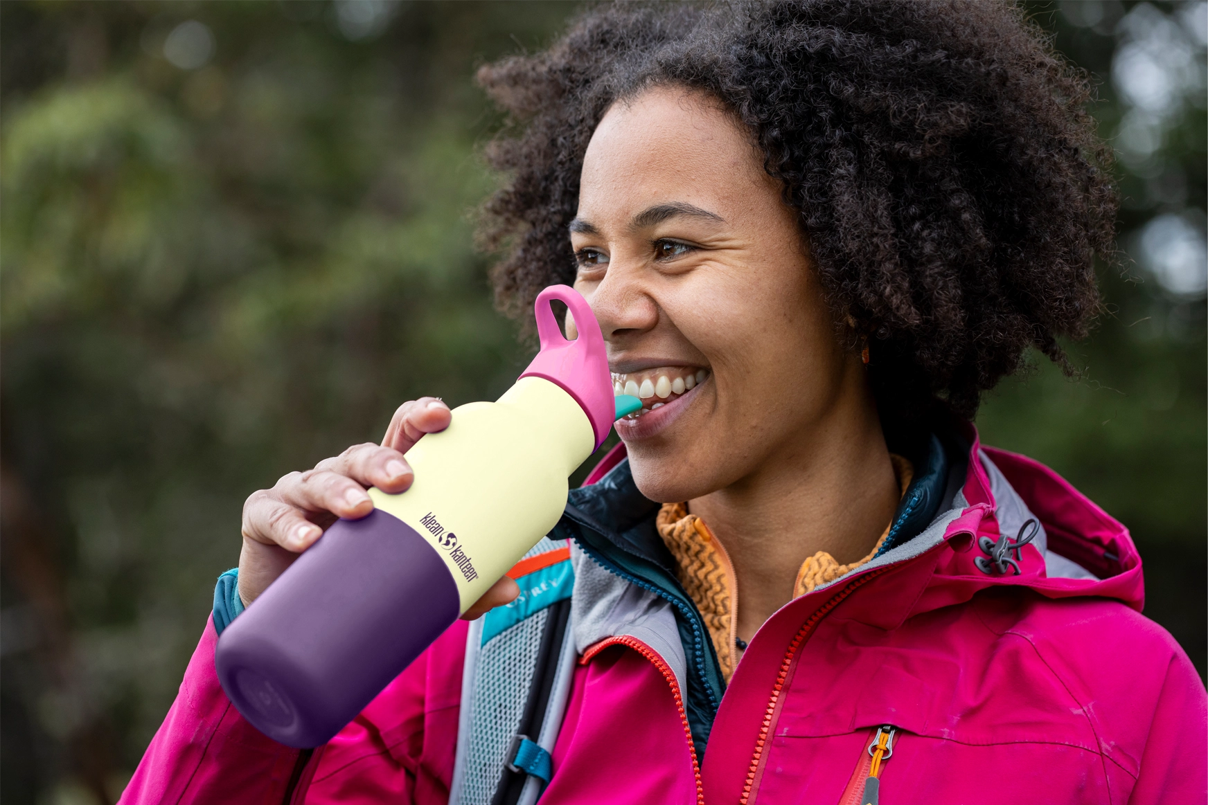 Hiker drinking from Klean Kanteen Rise Insulated Classic Bottle with Flip Seal Cap in limited edition Wax Yellow colourway.