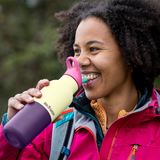 Hiker drinking from Klean Kanteen Rise Insulated Classic Bottle with Flip Seal Cap in limited edition Wax Yellow colourway.