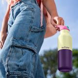 Girl holding Klean Kanteen Rise Insulated Classic Bottle with Flip Seal Cap in limited edition Wax Yellow colourway.