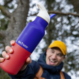Man holding Klean Kanteen Rise Insulated Classic Bottle with Flip Seal Cap in limited edition Dazzling Blue colourway.