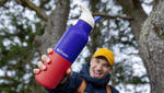 Man holding Klean Kanteen Rise Insulated Classic Bottle with Flip Seal Cap in limited edition Dazzling Blue colourway.