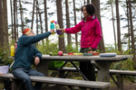 Hikers using Klean Kanteen Rise Insulated Classic Bottles on a picnic in the forest.