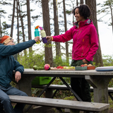 Hikers using Klean Kanteen Rise Insulated Classic Bottles on a picnic in the forest.
