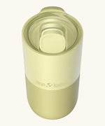 Klean Kanteen 16oz tumbler in wax yellow showing a matching splash proof slide lid on top