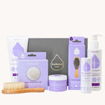 Kokoso Fragrance Free Collection Gift Set. Includes Baby Lotion, Baby-Soft Balm Stick, Natural Brush, Natural Sponge, Coconut Oil, Gentle Hair & Body Wash, on a cream background
