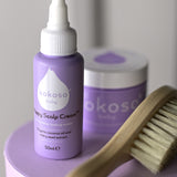 A close up of the products included with the sensitive gift set showing the scalp cream, natural baby brush and and organic coconut oil available at Babipur.
