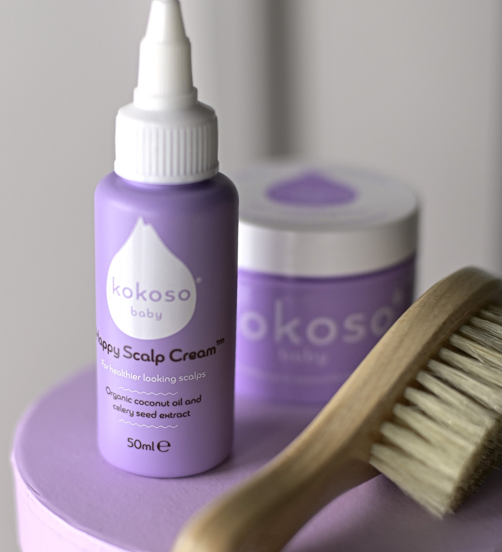 A close up of the products included with the sensitive gift set showing the scalp cream, natural baby brush and and organic coconut oil available at Babipur.