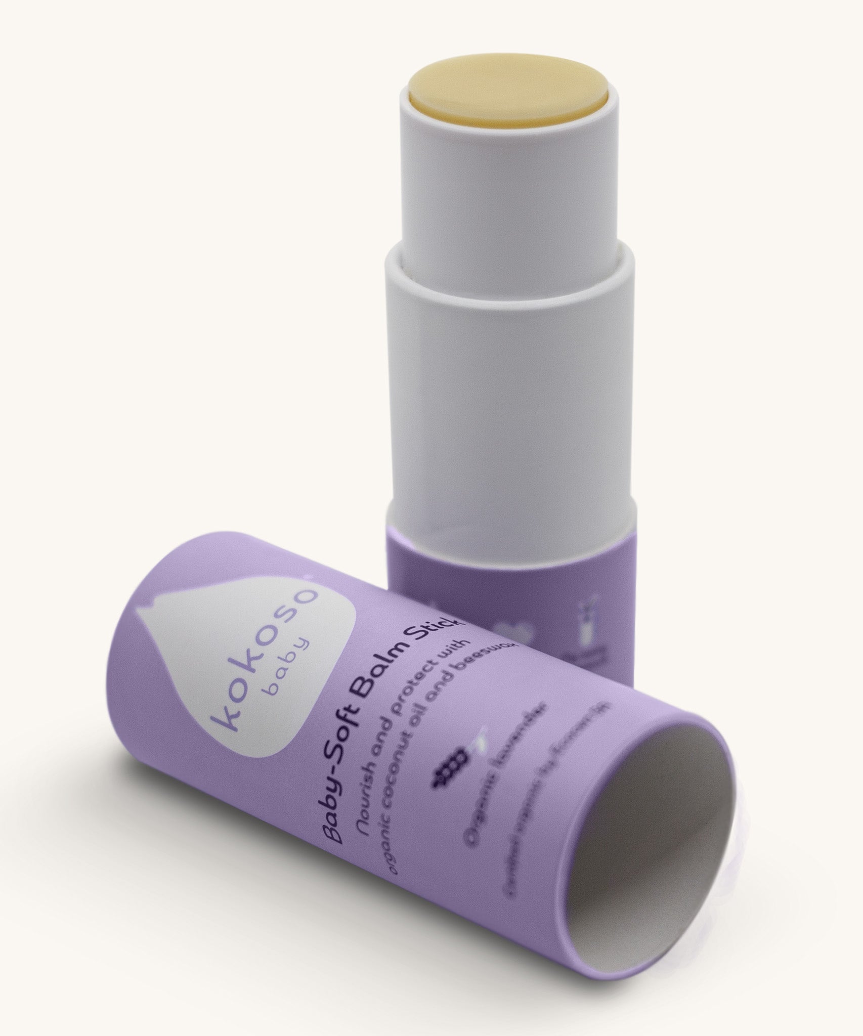 An open Kokoso baby soft balm stick available at Babipur showing the consistency of the balm. Comes in a lovely lilac twist tube