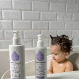  and Hair & Body Wash bottles next to each other on a white fluffy rug