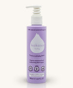 A bottle of the  Kokoso fragrance coconut oil baby lotion available at Babipur. Bottle features a push down dispenser 