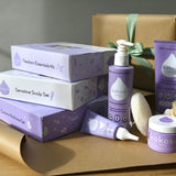A range of Kokoso gift sets on a table ready to be wrapped. Showing the newborn essentials kit, sensitive scalp set and coconut bathtime set all available at Babipur.