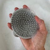  showing an adults hand through the loop handle for easier grip