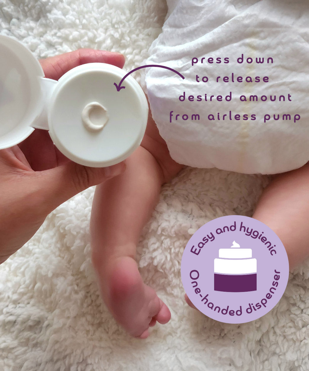 An adult hand holding the  tube of Kokoso organic coconut oil Happy Nappy Cream above a baby and showing the one handed dispenser feature.  Kokoso's range of organic  coconut oil baby care is available at Babipur. 
