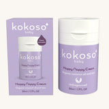 A tube of Kokoso organic coconut oil Happy Nappy Cream in a purple container placed next to a cardboard packaging box. Kokoso's range of organic  coconut oil baby care is available at Babipur. 