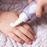 Some Kokoso Happy Scalp Cream being dispensed from the 50ml container onto a hand. The Kokoso baby care range is available at Babipur.