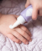 Some Kokoso Happy Scalp Cream being dispensed from the 50ml container onto a hand. The Kokoso baby care range is available at Babipur.