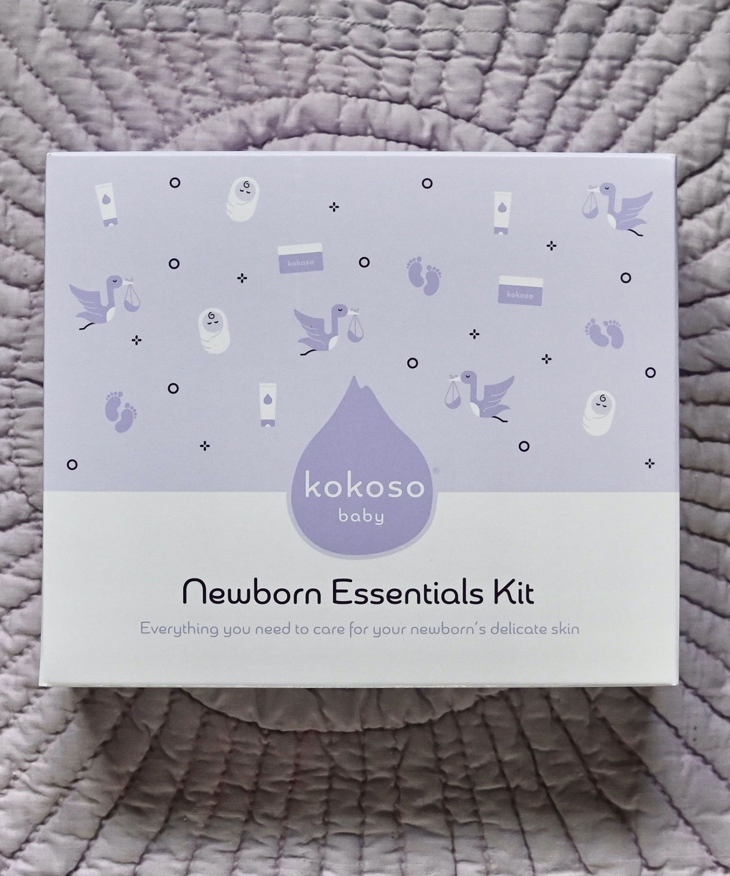 A top down image of the purple branded packging box for the Kokoso newborn essentials kit available at Babipur.