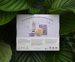 whist adult uses Kokoso Natural Baby Konjac Bath Sponge to dab the back of the babies head