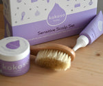 A close up of the products from the sensitive gift set showing the scalp cream, natural baby brush and and organic coconut oil available at Babipur.