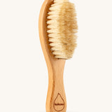 The Kokoso Natural Baby Hairbrush available at Babipur. Features a wooden handle and soft natural bristles