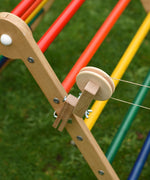 A close up of the clamp from the Kraul DIY Basket Cable Car STEM Kit attached to the side of a TriClimb.