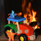 Kraul felt passenger pose-able dolls placed in the cab and on the roof the of the Bajo wooden tractor toy. These pose-able dolls are perfect to fit inside smaller toy vehicles and for use with the Kraul cable cars.