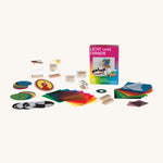 Kraul lights and colour kit showing the wooden spinning top, different patterned discs, a prism, polarization filters and mirrors