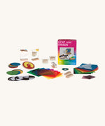 Kraul lights and colour kit showing the wooden spinning top, different patterned discs, a prism, polarization filters and mirrors