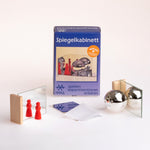 The Kraul kids mirror box set showing the different pieces which includes two mirrors, a flexible mirror and a reflective glass ball