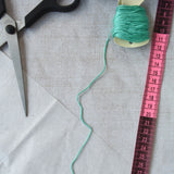 Some of the contents of the Kraul parachute kit laid out ready for the parachute to be made. The kit contains papers, thread and a mini basket. Kraul offers a range of thoughtful science toys that bring natural forces to life through real-world exploration and play.