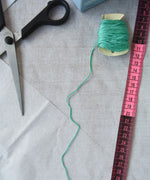 Some of the contents of the Kraul parachute kit laid out ready for the parachute to be made. The kit contains papers, thread and a mini basket. Kraul offers a range of thoughtful science toys that bring natural forces to life through real-world exploration and play.