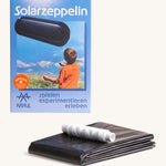 Kraul solar airship kit showing the recyclable black plastic airship tube and white string 