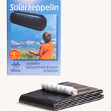 Kraul solar airship kit showing the recyclable black plastic airship tube and white string 