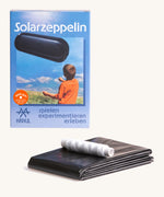 Kraul solar airship kit showing the recyclable black plastic airship tube and white string 