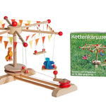 Kraul Wooden Swing Roundabout Kit with passenger dolls next to product box