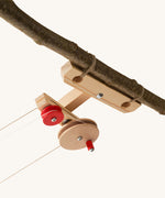Kraul wooden top station kit for big cable cars shown tied to a branch.