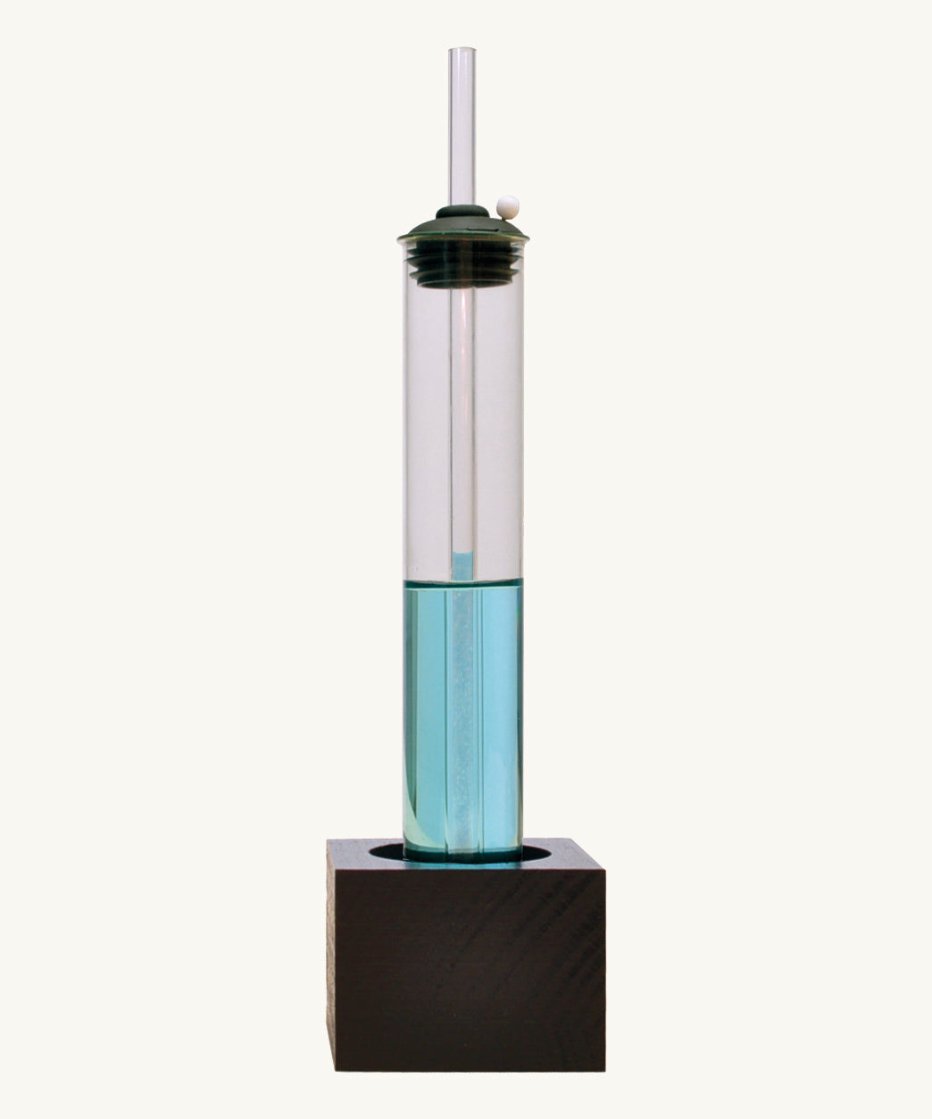 Front view of the Kraul weather kit showing the glass tube with blue liquid on a black wooden stand