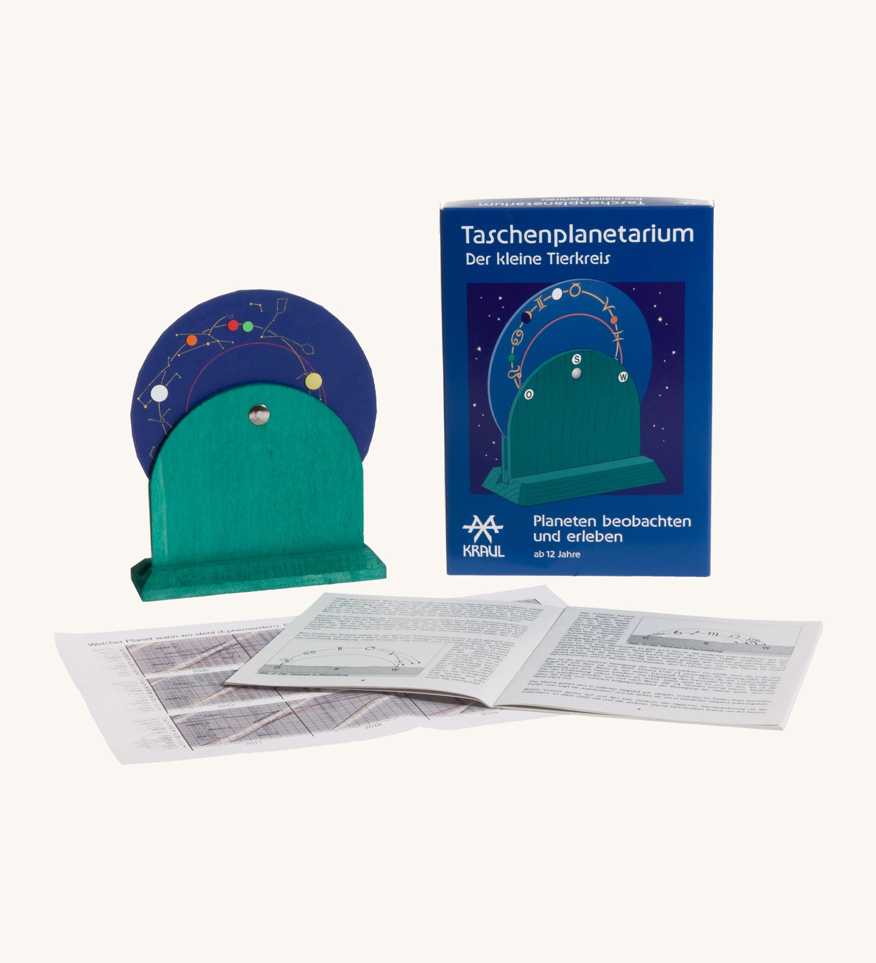 Kraul wooden pocket planetarium set showing the blue disk with different zodiac  symbols with a paper booklet. 