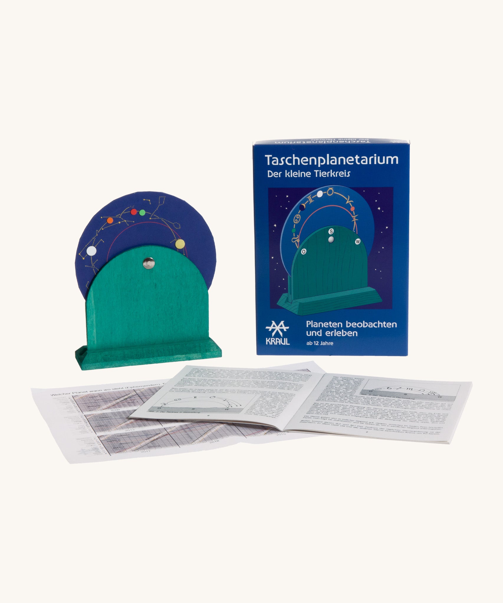 Kraul wooden pocket planetarium set showing the blue disk with different zodiac  symbols with a paper booklet. 