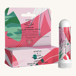 Light and dark pink nasal stick box with nasal stick on a cream background