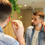 A person using the Lamazuna Wooden Bamboo Oriculi Ear Cleaning Stick