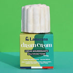 Lamazuna Nourishing Dream Cream Bar, sat on top of its box on a green background