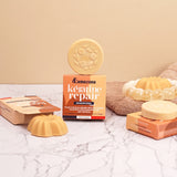 Lamazuna Keratin Repair solid shampoo bar and Keratin Shine conditioner bar arranged with their packaging on a marble bathroom surface.