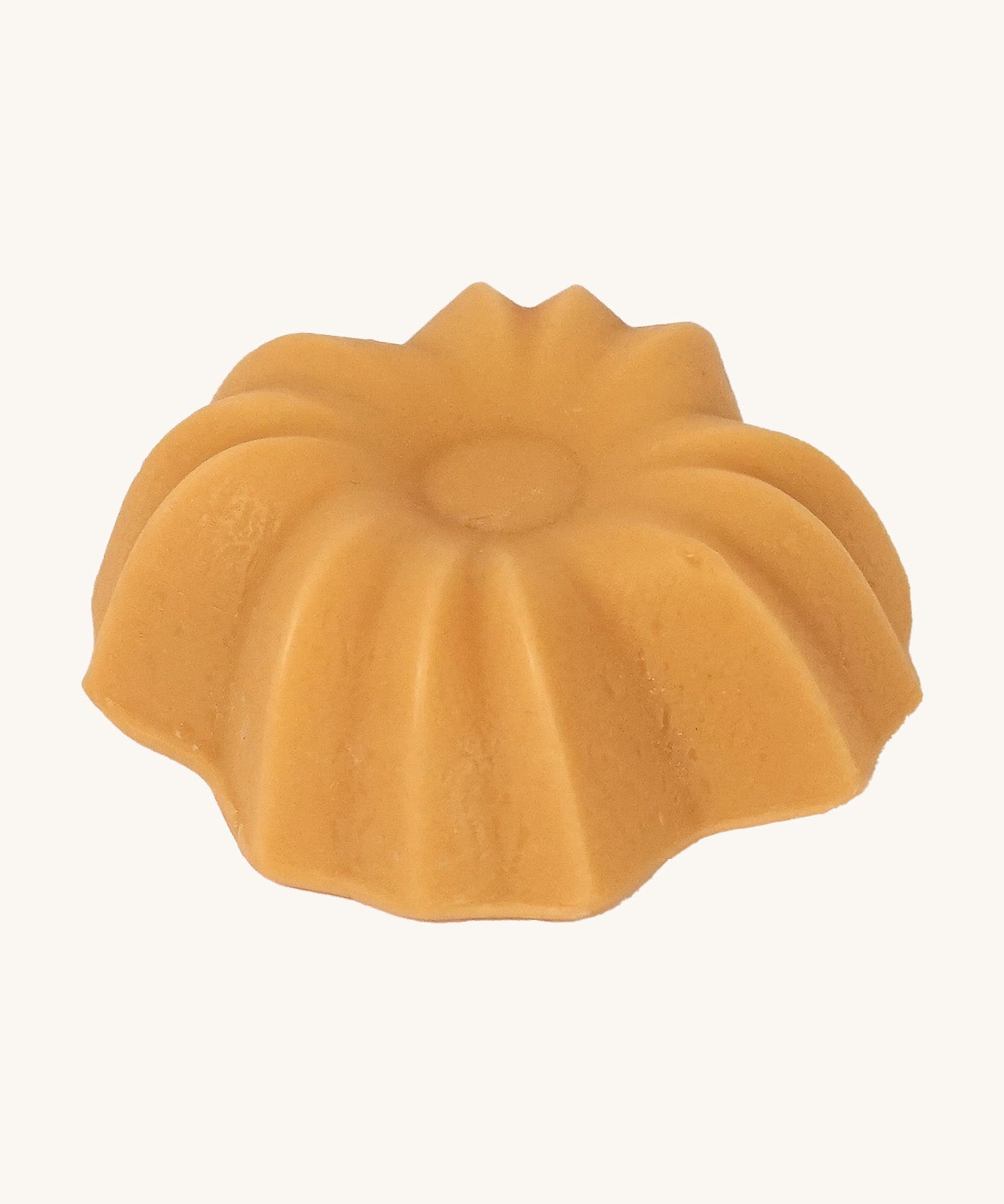 Lamazuna Keratin Shine solid conditioner bar close-up showing its fluted flower-shaped design.