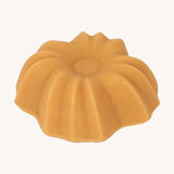 Lamazuna Keratin Shine solid conditioner bar close-up showing its fluted flower-shaped design.