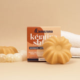 Lamazuna Keratin Shine solid conditioner bar shown in front of its box packaging, styled with bathroom accessories.