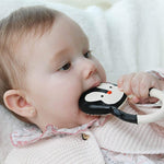 Baby chewing the Lanco Nui the Penguin Teether